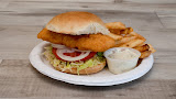 Grilled chicken sandwich with onion rings